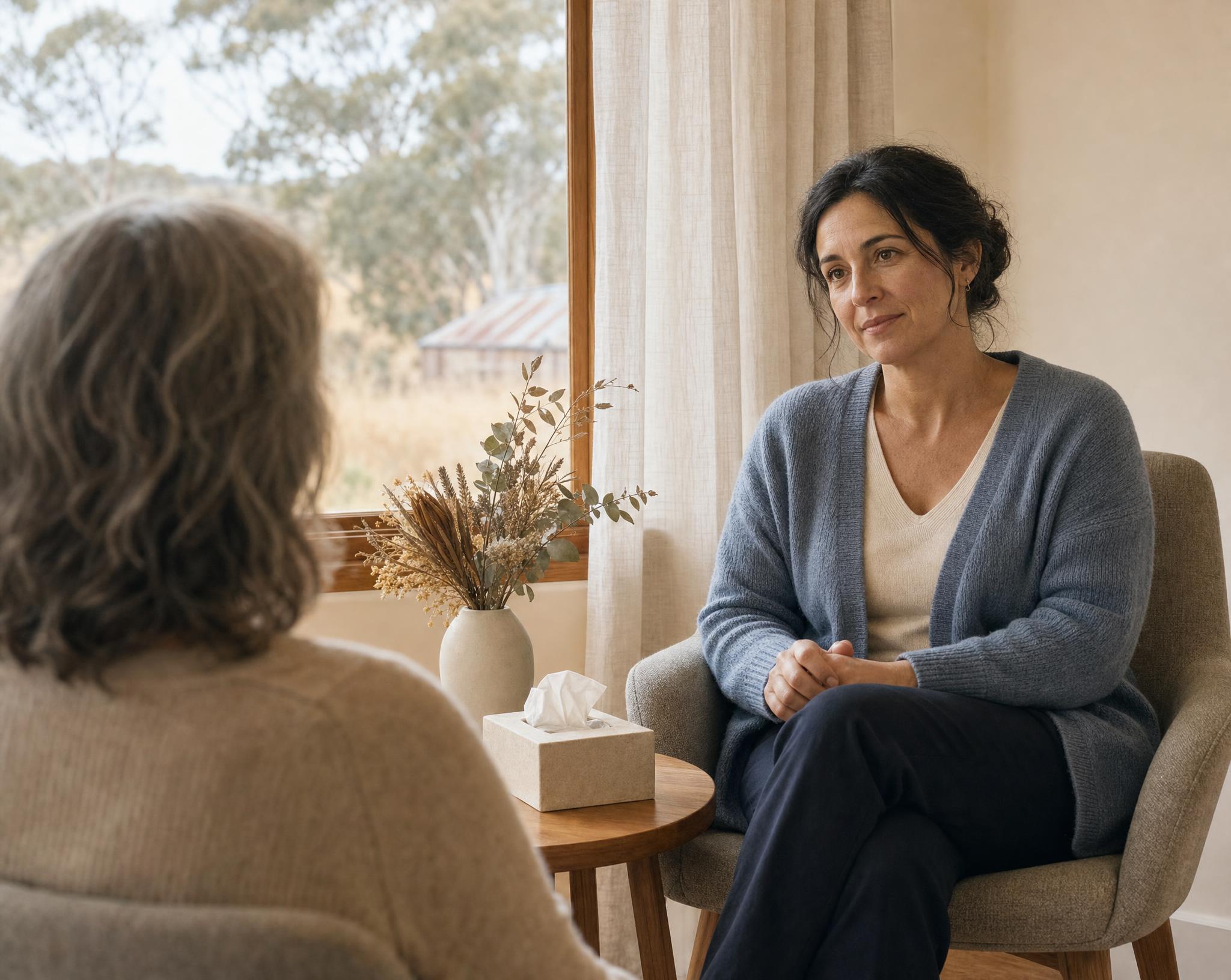 Counsellor listening quietly during a grief counselling session in regional Victoria